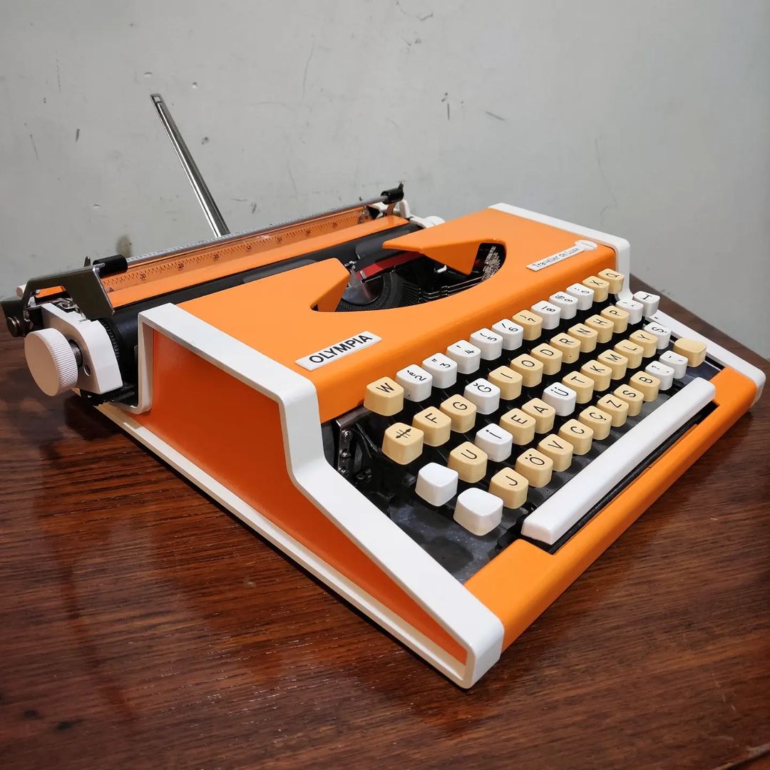 1970's Germany  Olympia brand Traveller De Luxe model portable popart typewriter