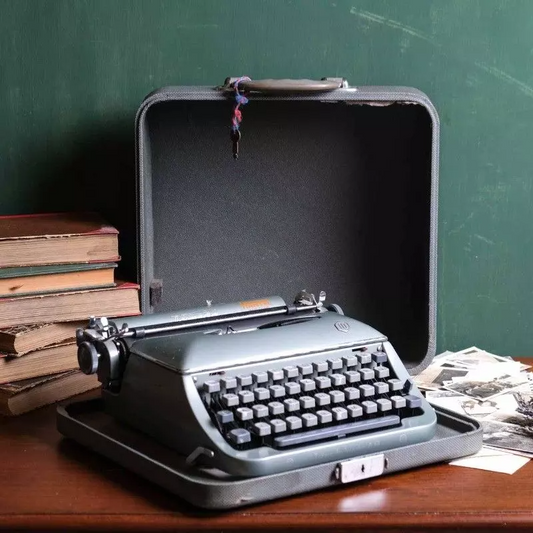 Torpedo brand typewriter with vintage bag.