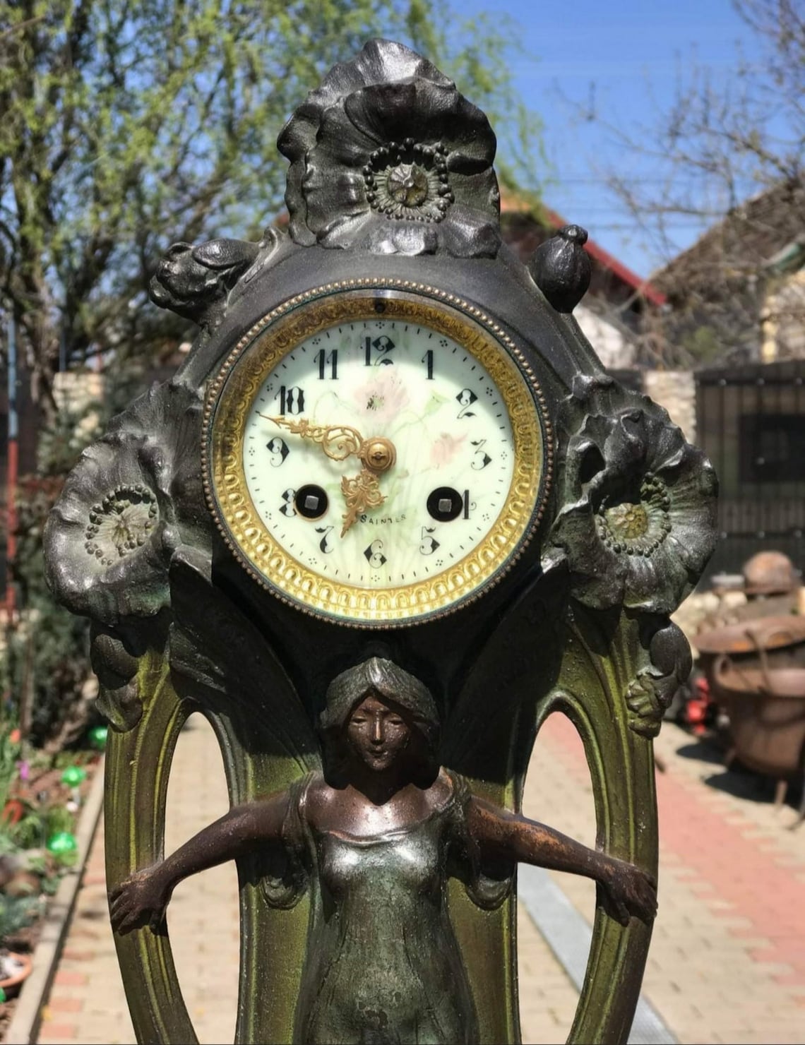 20th century bronze-plated Art Nouveau style French cast metal antique clock.