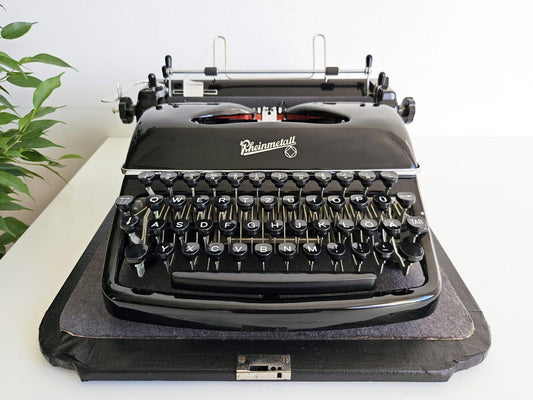 Rheinmetall KST Typewriter, original black color, from the 1950s. With original case. Collectible. Unusual gift.