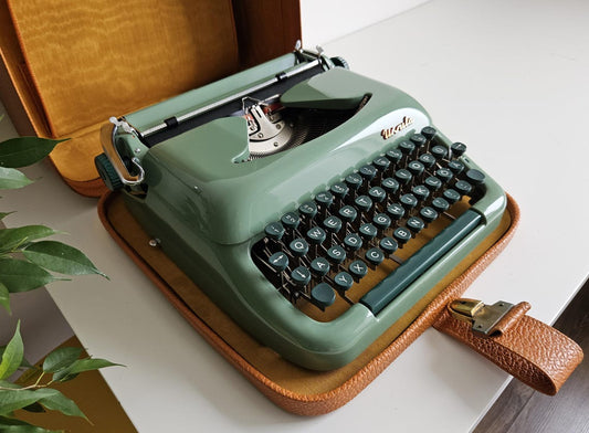 Green Ursula portable working vintage typewriter from the 1950s. With case, unusual gift